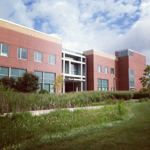 Front entrance of BTEC with bioswale in foreground.
