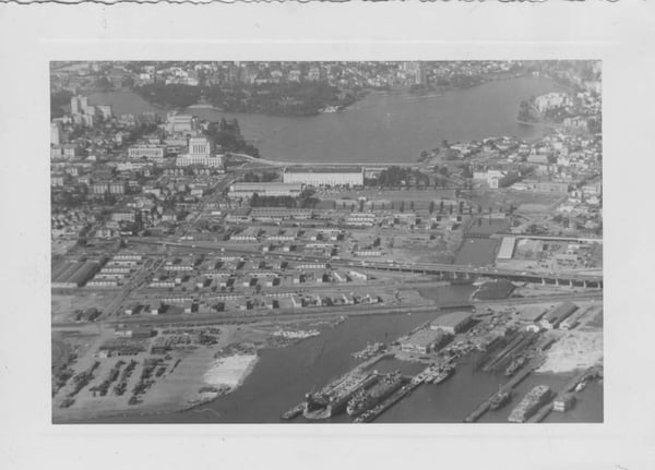 A 1950s aerial view of the lands south of Lake Merritt showing Auditorium Village, a wartime housing project, the Exposition Center, and Exposition Field.