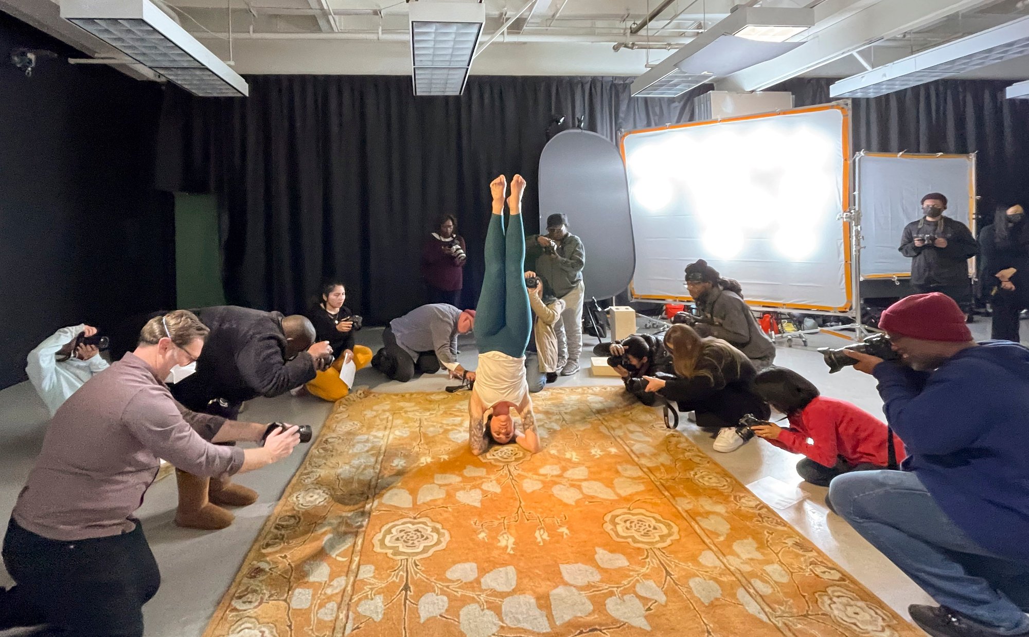 Photography department woman doing a headstand