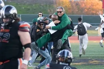 Coach Beam Celebrating