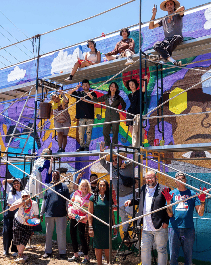 Laney College Students with Vibrant Mural 